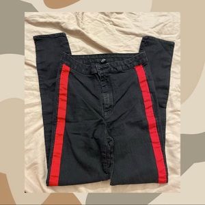 Black skinny jeans with red stripe